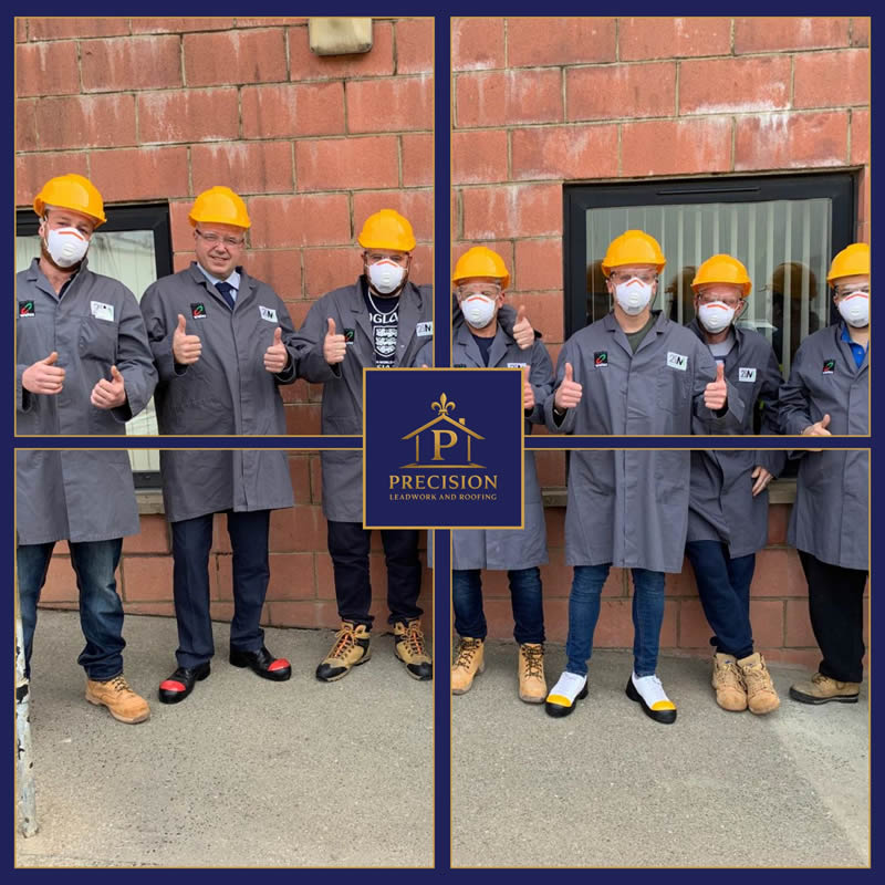 Team of roofing professionals in gray coats and hard hats, giving thumbs up in front of a brick wall, featuring the Precision Leadwork and Roofing logo, emphasizing teamwork and expertise in roofing services.